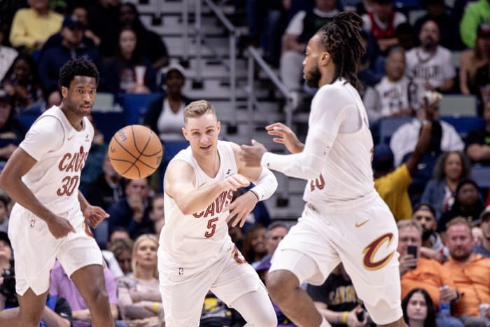 Mar 13, 2024; New Orleans, Louisiana, USA; Cleveland Cavaliers guard Sam Merrill (5) passes the ball to guard Darius Garland (10) against the New Orleans Pelicans during the first half at Smoothie King Center. Mandatory Credit: Stephen Lew-USA TODAY Sports
